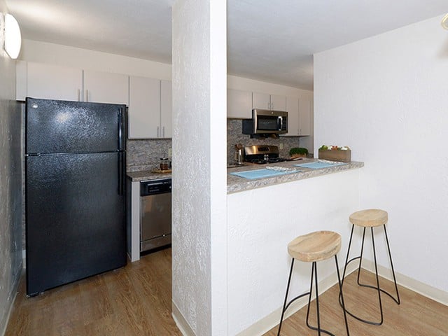 a white kitchen inside a Braintree Village apartment in Braintree, MA
